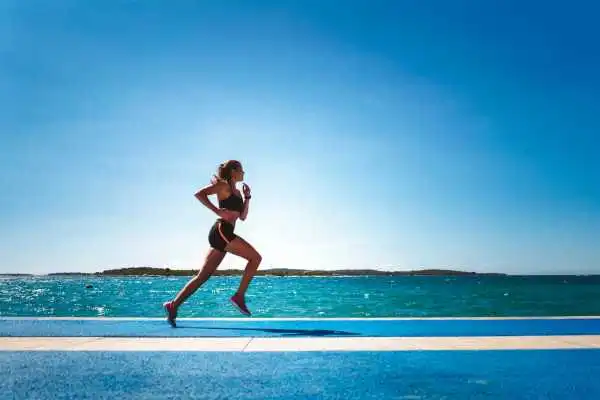 Woman running showing strong leg muscle Beaconsfield